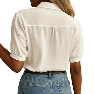 Women's white button front blouse with classic collar angled view